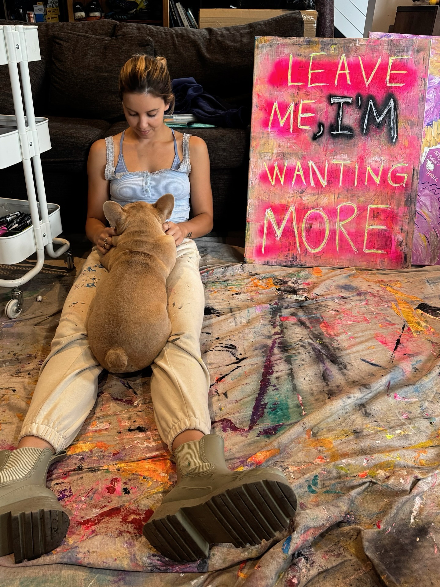 Gabrielle May painting in her studio