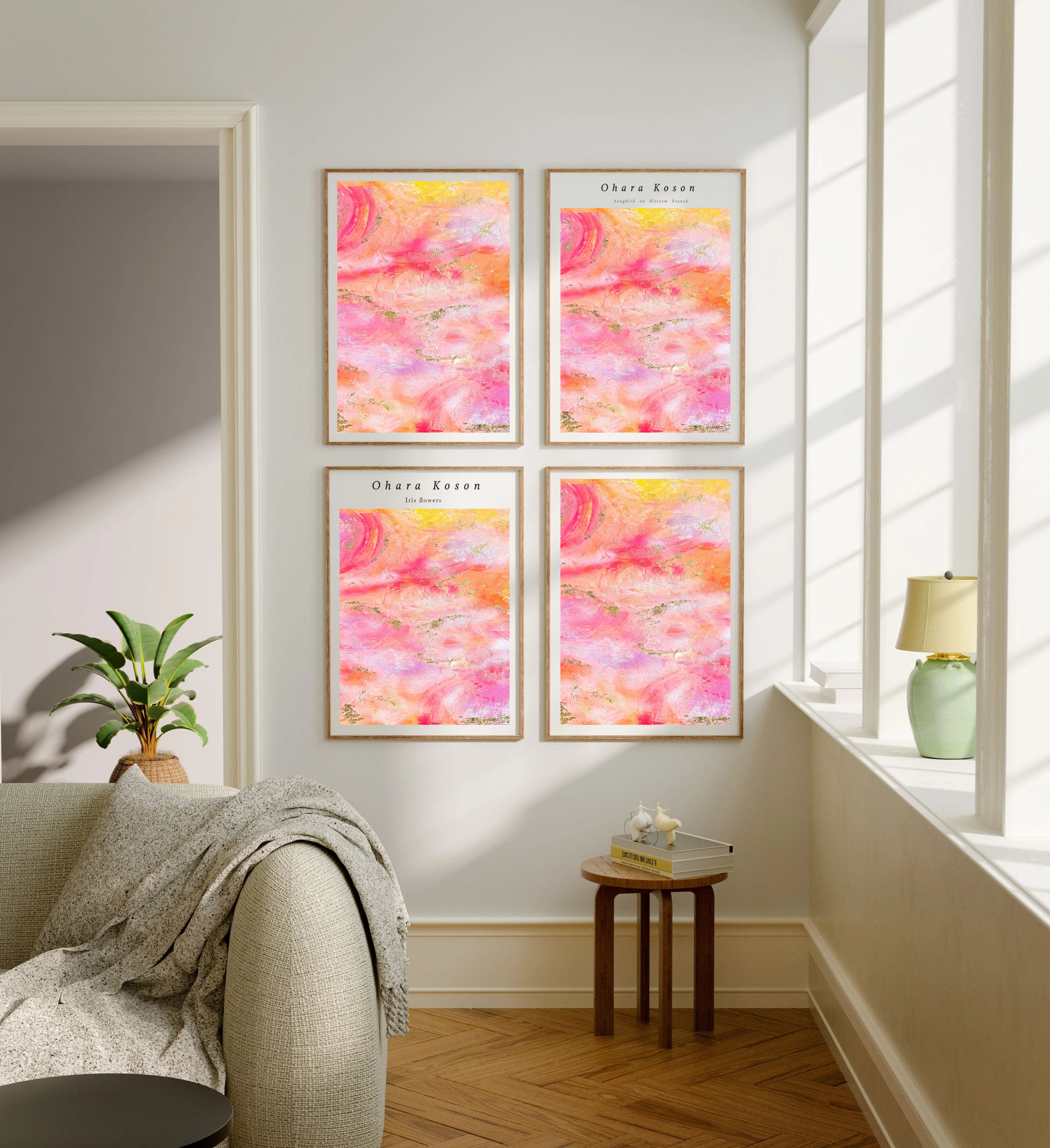 Four Summer Love artworks hung in a grid on a living room wall