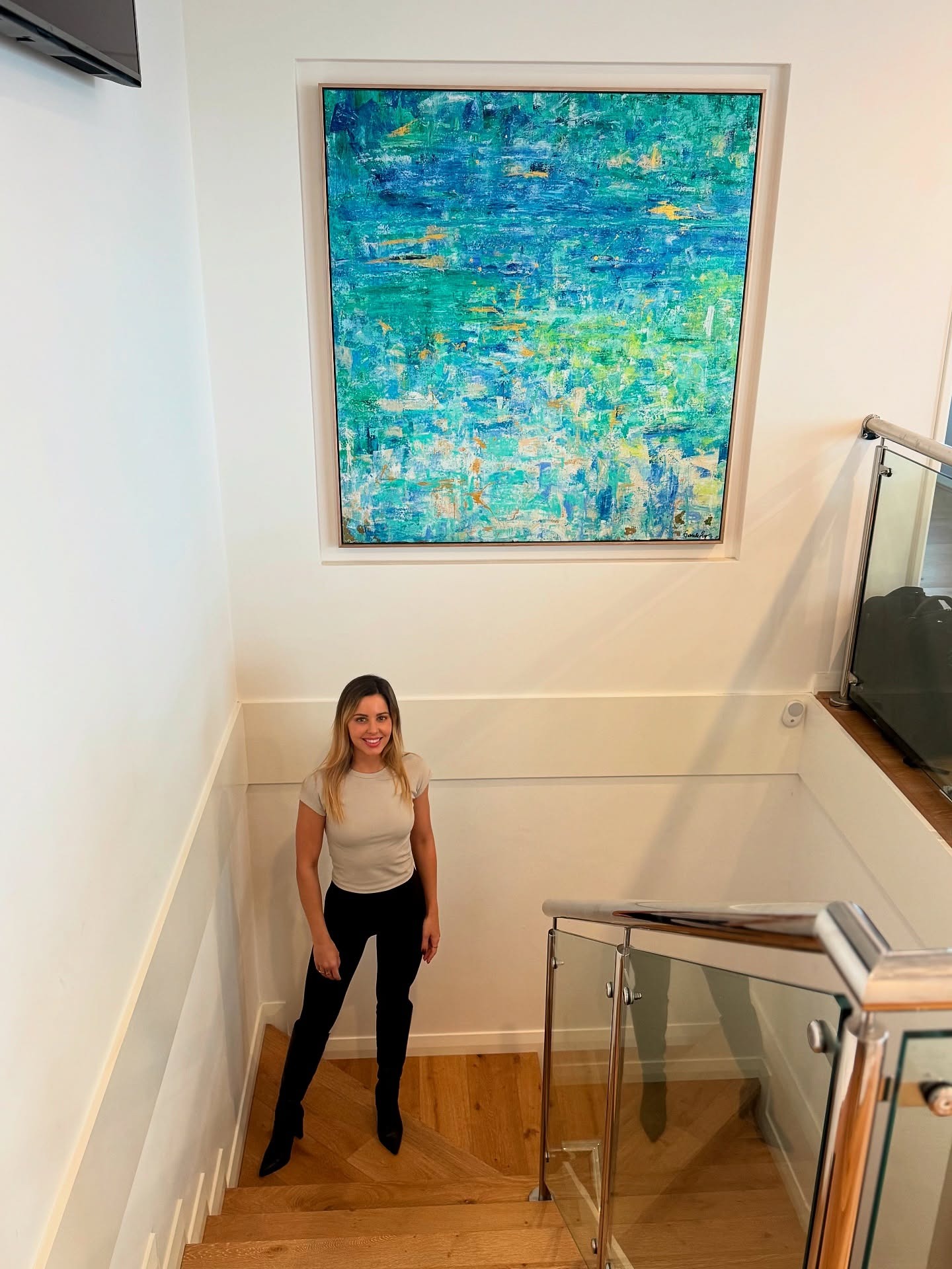 Instagram preview of an abstract painting displayed in an interior